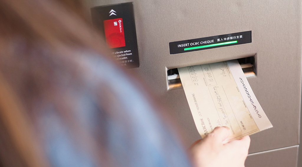 OCBC Enables Instant Cash-out For Cheques under $30,000 OCBC Bank Is First In Southeast Asia To Enable Instant Encashment Of Cash Cheques At ATMs